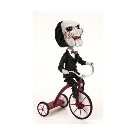 Figura neca saw head knocker puppet on tricyclesue)